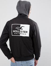 Черный эластичный бомбер с логотипом на спине и капюшоном Hollister 1257039