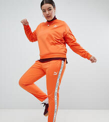 Оранжевые спортивные штаны с полосками по бокам Puma эксклюзивно для A 1251940